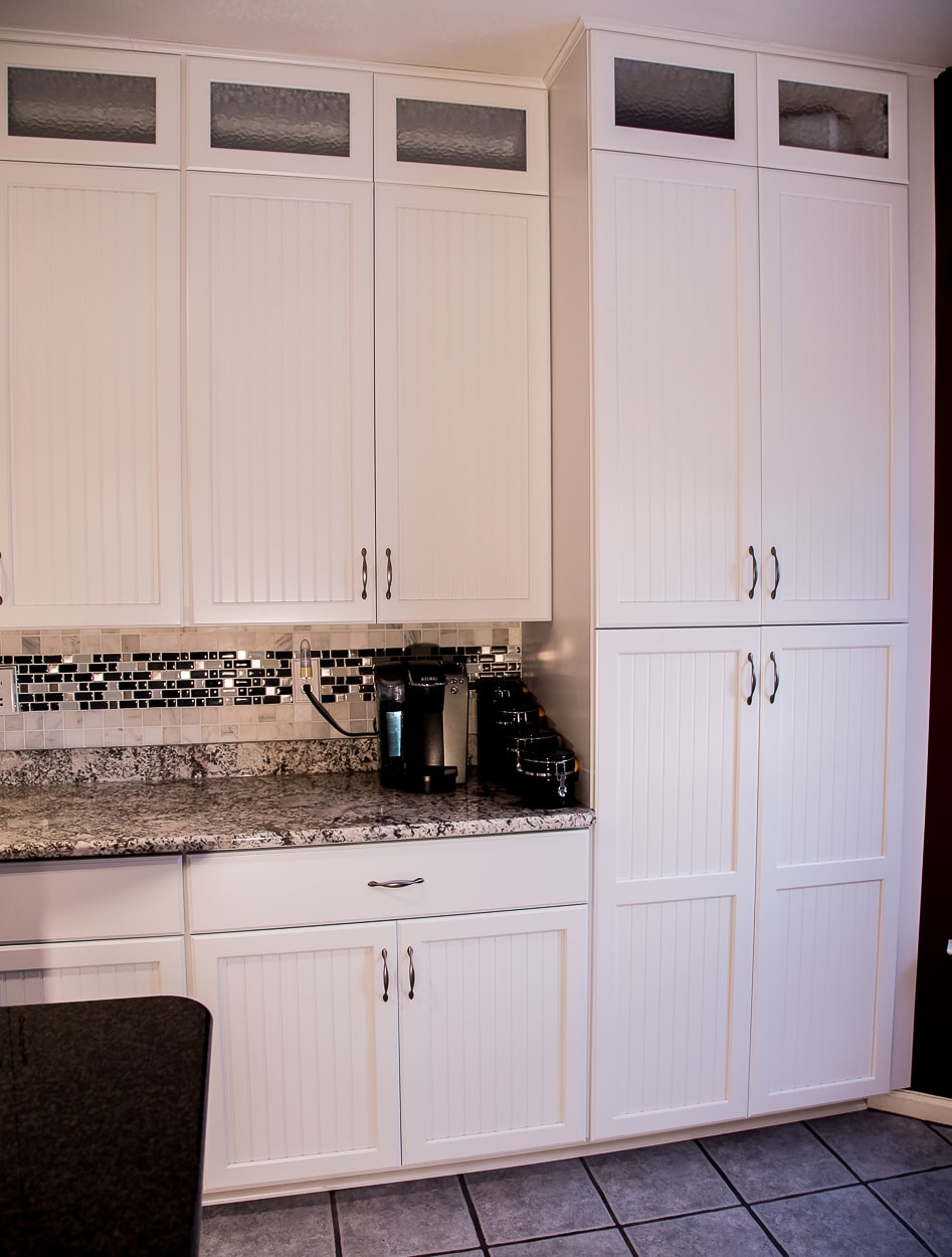 By repairing structural damage and keeping their existing cabinet boxes