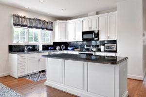 white custom cabinet refacing in a modular home kitchen