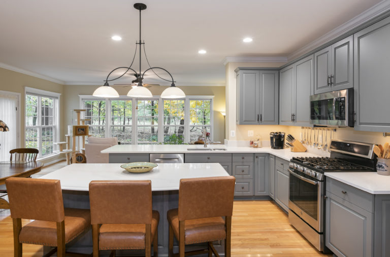 Stunning view of open concept kitchen into the adjoining living room. 