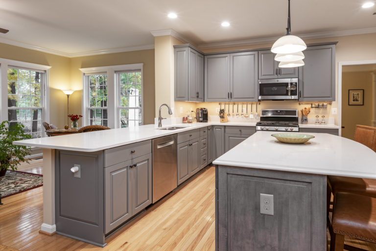 Decorative door panels on the sides of the cabinets and island dress up the ends. 