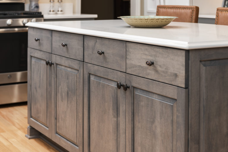 Slab drawer fronts and center raised panel doors provide a nice contrast of traditional and contemporary styles. 