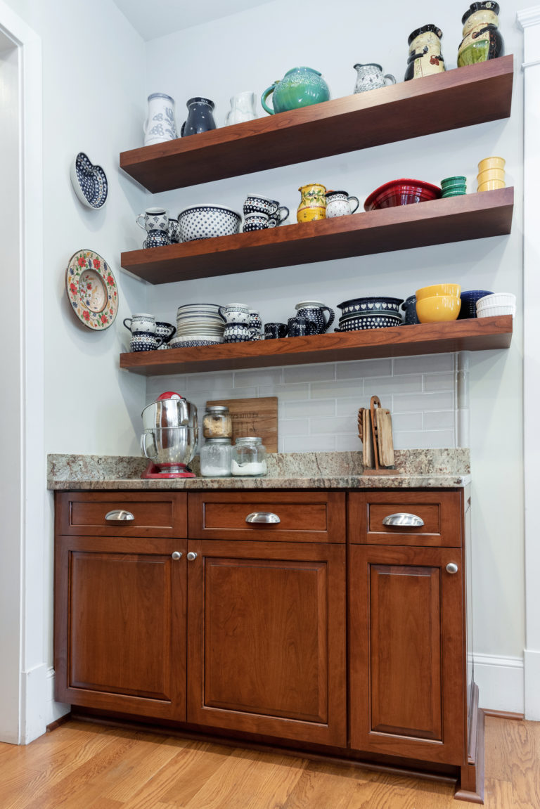 Floating shelves and updated base cabinets provide extra storage. 
