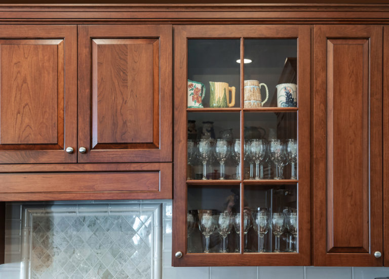 Glass doors provide an area to display treasured items.   