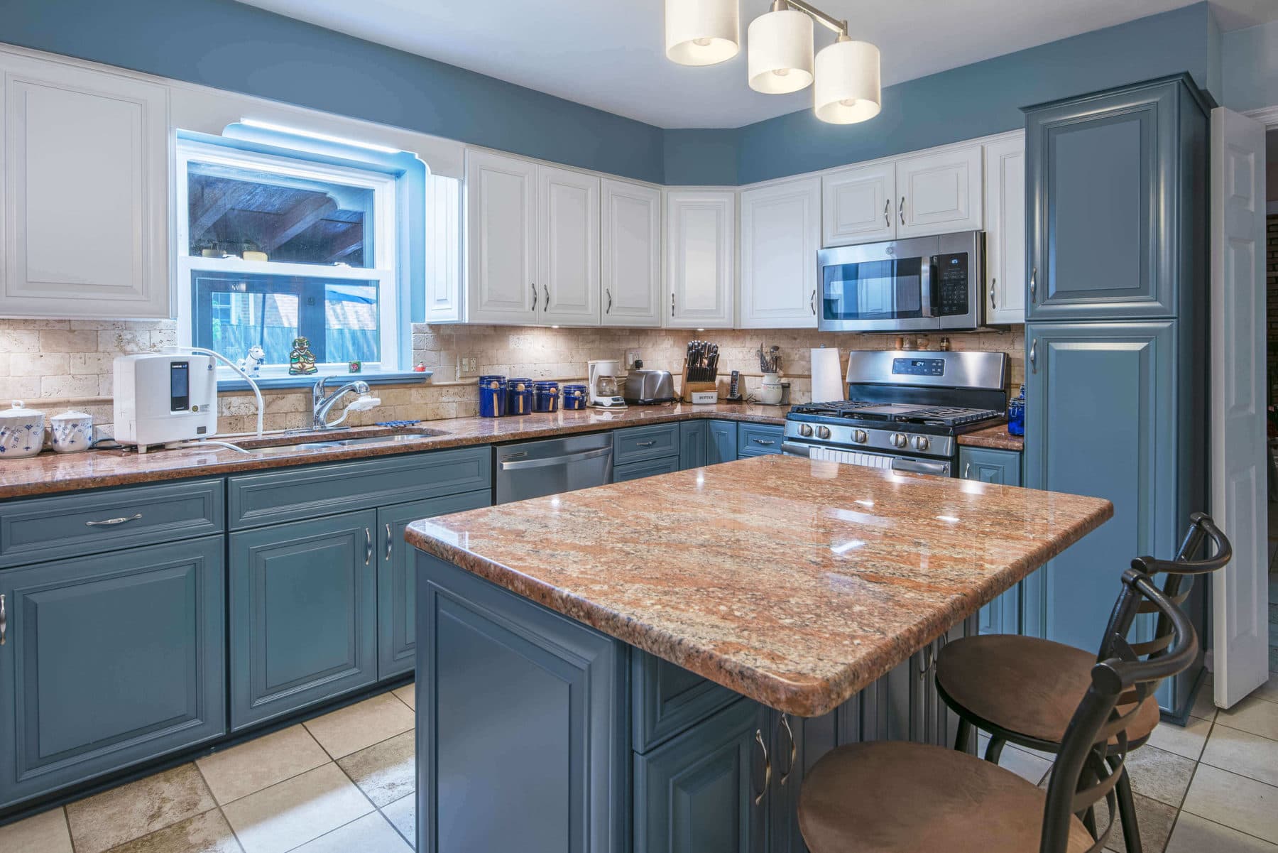 An elegant kitchen highlight with Blue Cabinet