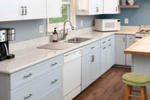 Light-colored cabinetry paired with white countertops