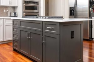 Dark gray-colored cabinets paired with white countertops