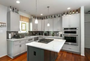 Beautifully refaced kitchen cabinets providing a refreshed and lively look for the space as a whole