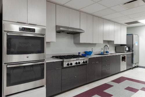 This teaching kitchen was donated by Kitchen Saver to the Stoler Early Childhood Center at a JCC local to one of our offices. The kitchen classroom is designed for teaching about healthy foods and kitchen safety. The clean, simple style keeps the kids' focus on the teacher, and there's plenty of room for a whole class of little students! The unique, shorter custom cabinets allow children to work at their own height.