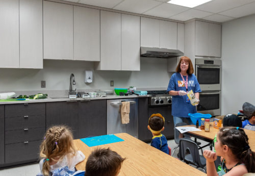 This teaching kitchen was donated by Kitchen Saver to the Stoler Early Childhood Center at a JCC local to one of our offices. The kitchen classroom is designed for teaching about healthy foods and kitchen safety. The clean, simple style keeps the kids' focus on the teacher, and there's plenty of room for a whole class of little students! The unique, shorter custom cabinets allow children to work at their own height.