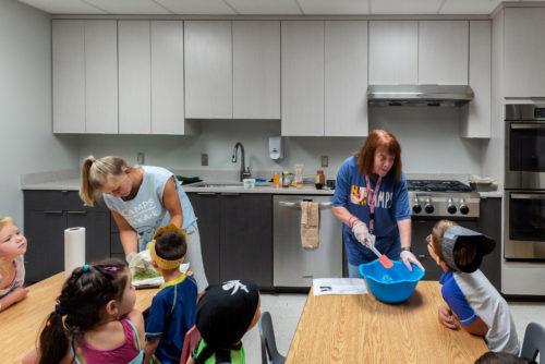 This teaching kitchen was donated by Kitchen Saver to the Stoler Early Childhood Center at a JCC local to one of our offices. The kitchen classroom is designed for teaching about healthy foods and kitchen safety. The clean, simple style keeps the kids' focus on the teacher, and there's plenty of room for a whole class of little students! The unique, shorter custom cabinets allow children to work at their own height.